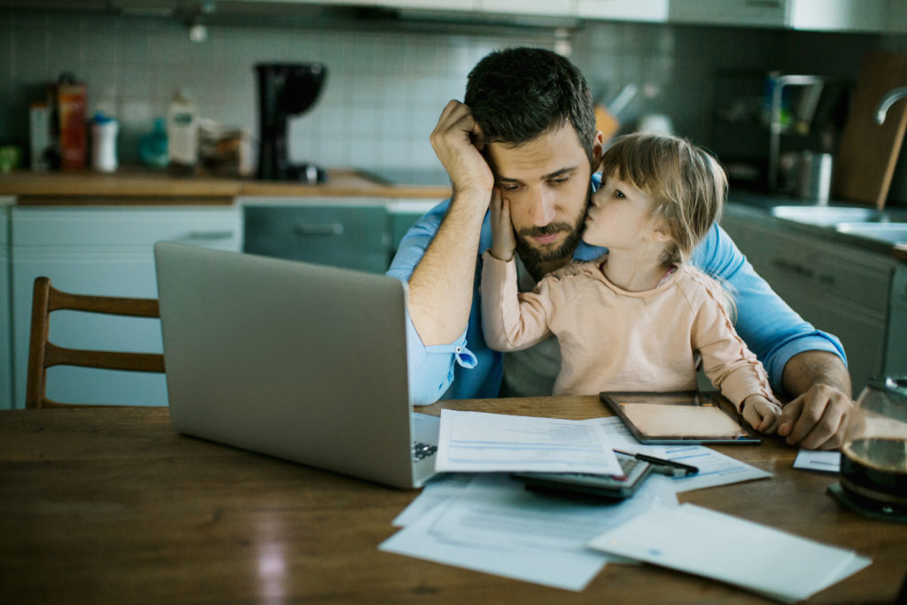 Father Daughter paying bills